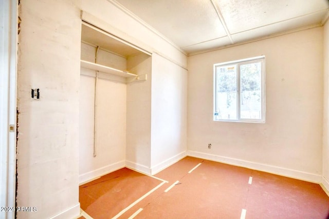 unfurnished bedroom featuring a paneled ceiling