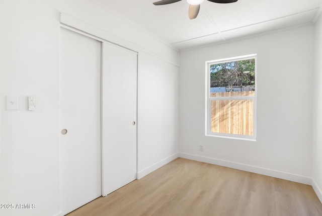 unfurnished bedroom with a closet, ceiling fan, and light hardwood / wood-style flooring