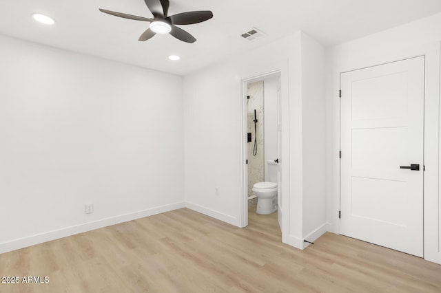 unfurnished bedroom with ensuite bathroom, ceiling fan, and light hardwood / wood-style floors