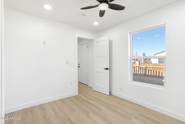 unfurnished bedroom featuring ceiling fan and light wood-type flooring