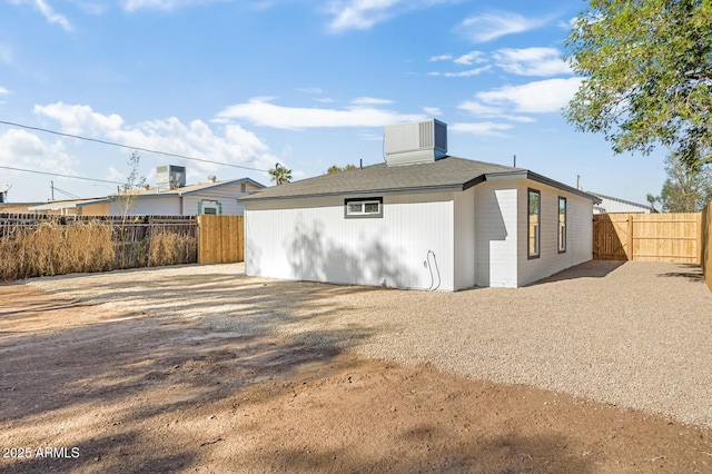 back of property with central AC unit