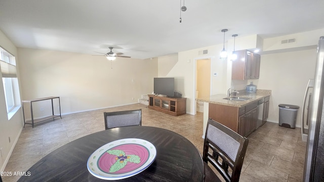 14620 N Yerba Buena Way Unit B, Fountain Hills, AZ 85268 - kitchen with a sink, a ceiling fan, appliances with stainless steel finishes, baseboards, and pendant lighting