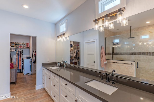 bathroom with vanity, hardwood / wood-style floors, and walk in shower