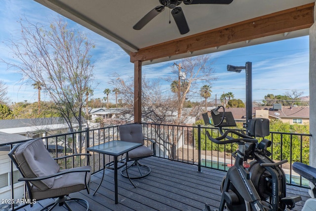 wooden terrace featuring ceiling fan