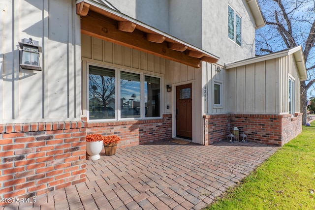 entrance to property with a patio area