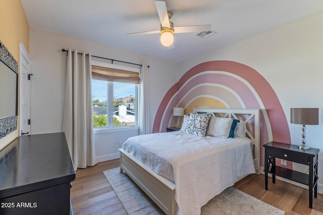 bedroom with ceiling fan and light wood-type flooring