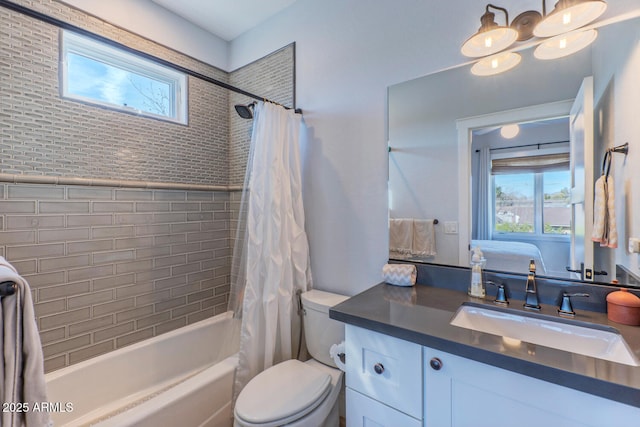 full bathroom with vanity, toilet, and shower / bath combo