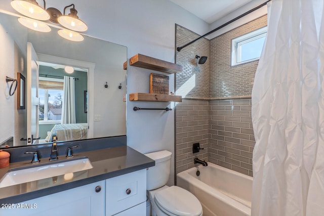 full bathroom with vanity, toilet, and shower / bath combo with shower curtain