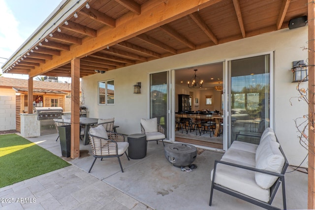 view of patio / terrace with an outdoor kitchen and grilling area