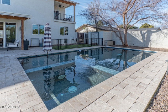 view of pool featuring a patio and ceiling fan