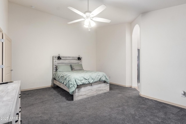 bedroom featuring dark carpet and ceiling fan