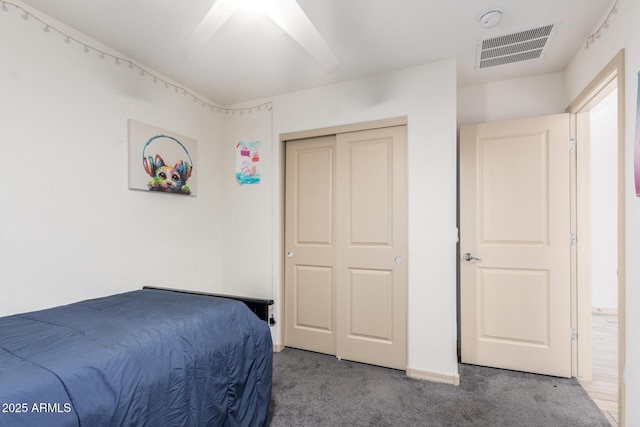 bedroom with carpet floors and a closet