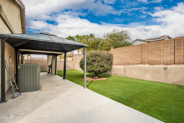 view of yard with a gazebo, a patio, and central air condition unit