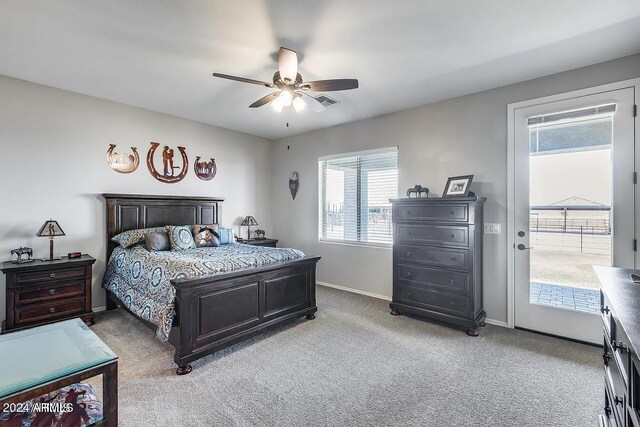 bedroom featuring access to outside, ceiling fan, and light colored carpet