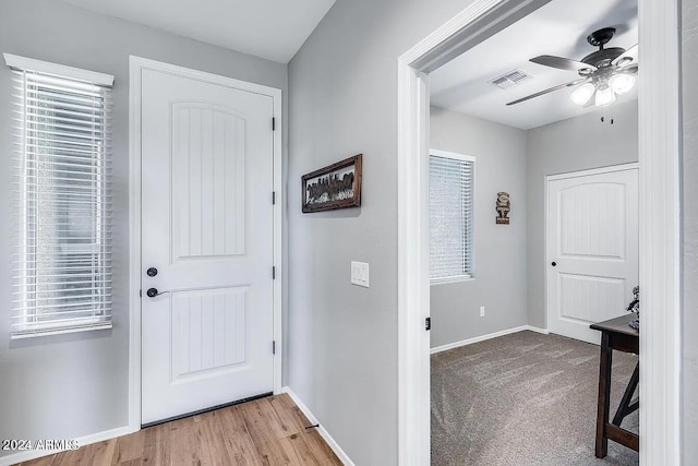 entrance foyer with ceiling fan