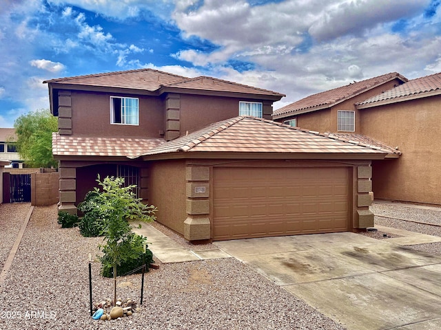272 S 228th Ln, Buckeye, AZ 85326 - view of front facade featuring an attached garage, stucco siding, and concrete driveway