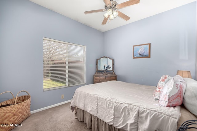 bedroom with baseboards, ceiling fan, and light colored carpet