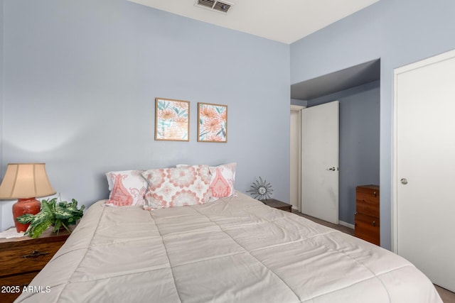 bedroom featuring visible vents