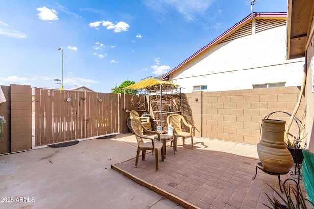 view of patio / terrace featuring fence