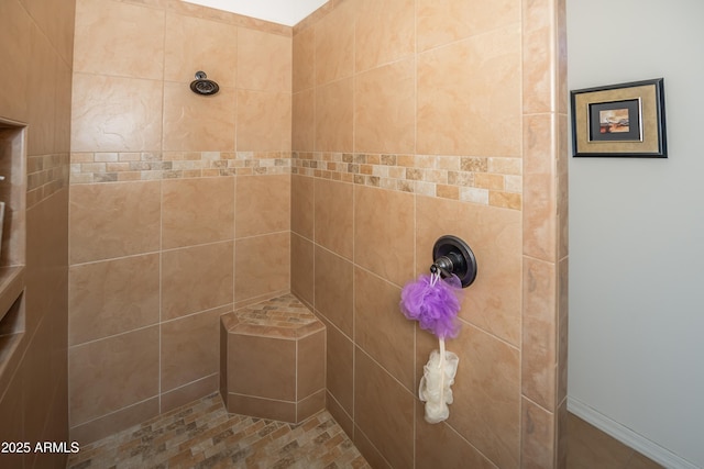 bathroom featuring tiled shower