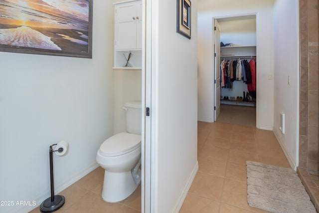 bathroom with tile patterned floors and toilet