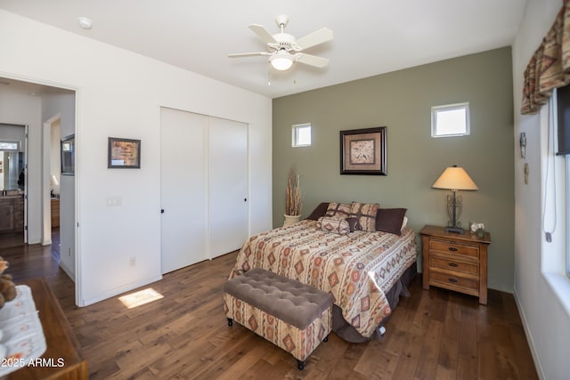 bedroom with dark hardwood / wood-style floors, ceiling fan, and a closet