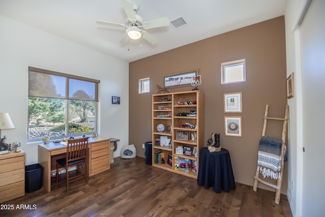 home office featuring dark hardwood / wood-style floors and ceiling fan