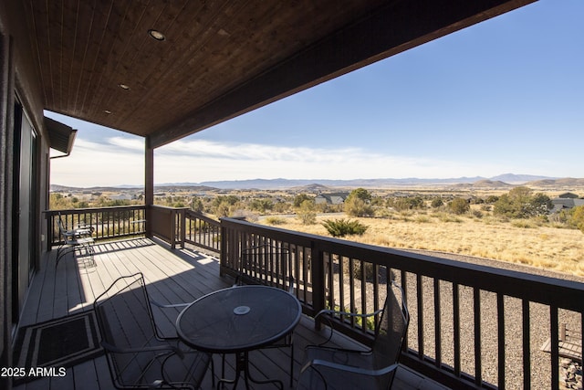 wooden deck featuring a mountain view