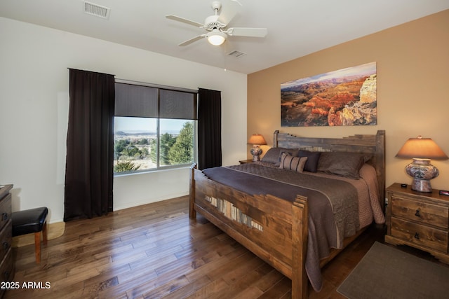 bedroom with dark wood-type flooring and ceiling fan