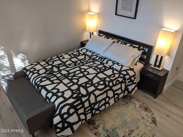 bedroom featuring wood finished floors