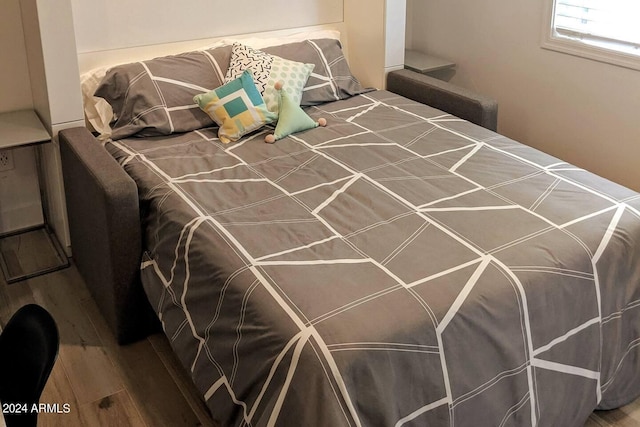 bedroom featuring wood finished floors