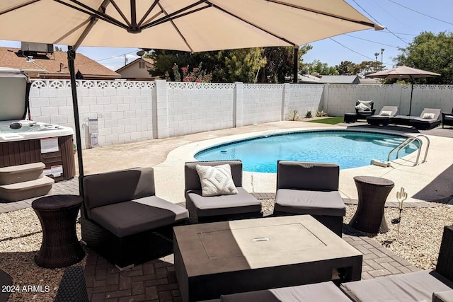 view of pool featuring a fenced in pool, a patio, a hot tub, a fenced backyard, and an outdoor living space