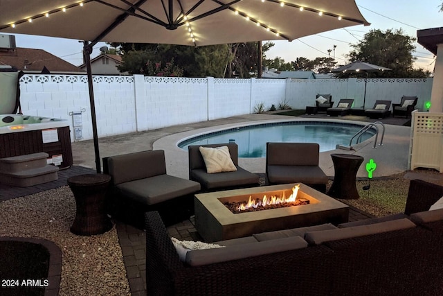 view of pool with a patio area, a fenced backyard, an outdoor fire pit, and a fenced in pool