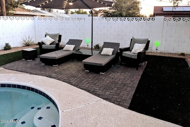 view of patio with a fenced backyard and an outdoor living space