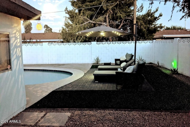 view of swimming pool with a fenced in pool, a patio area, and a fenced backyard