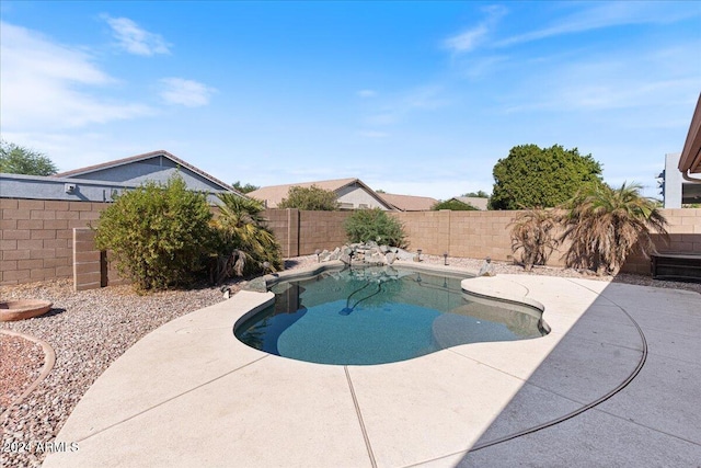 view of swimming pool with a patio area