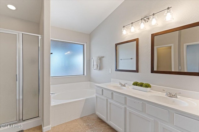 bathroom featuring vanity, independent shower and bath, lofted ceiling, and tile patterned flooring