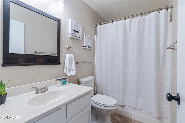 full bathroom with vanity, shower / tub combo, toilet, and tile patterned flooring