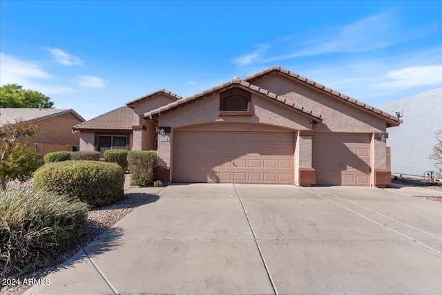 view of front of property with a garage