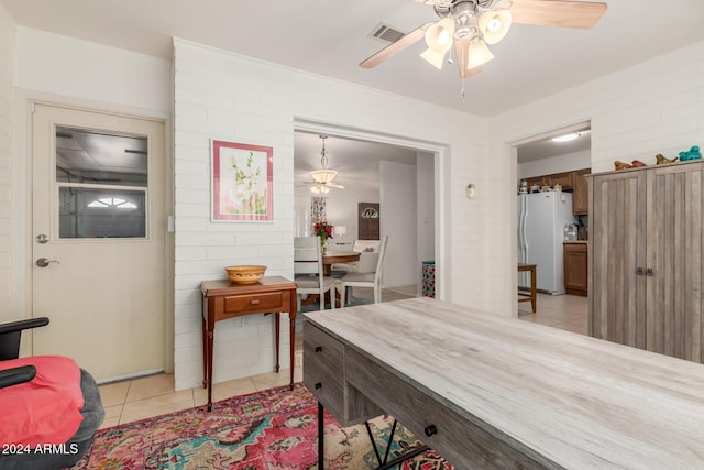 dining room featuring ceiling fan and light tile patterned flooring