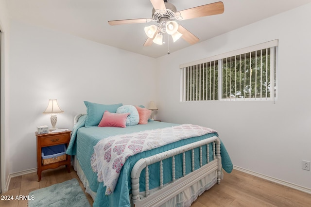 bedroom featuring ceiling fan and light hardwood / wood-style floors