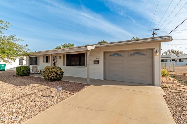 single story home with a garage