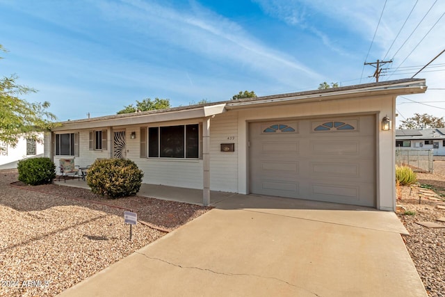 single story home featuring a garage