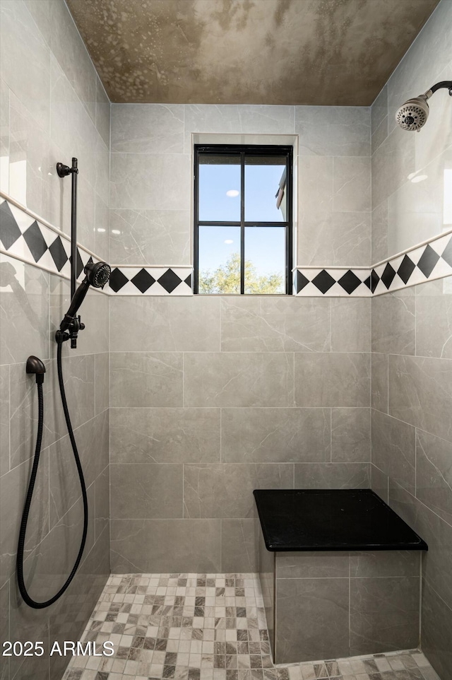 bathroom with tiled shower