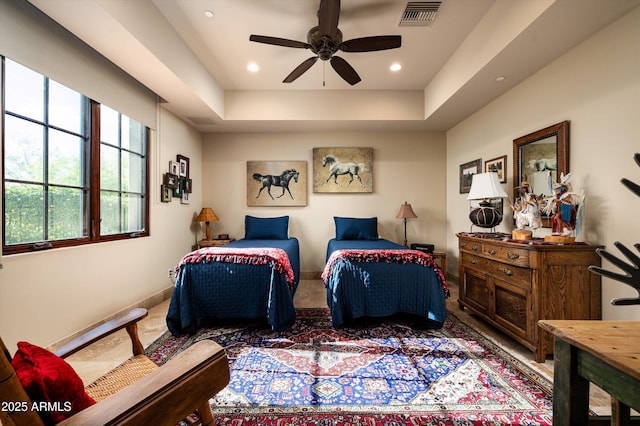 bedroom with recessed lighting, baseboards, a tray ceiling, and ceiling fan