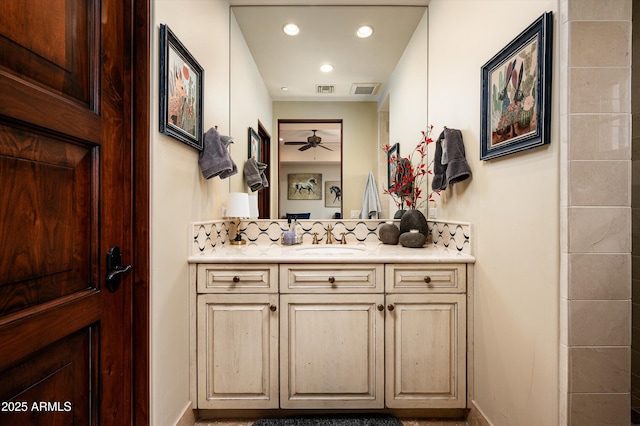 bathroom featuring tasteful backsplash, a ceiling fan, vanity, baseboards, and recessed lighting