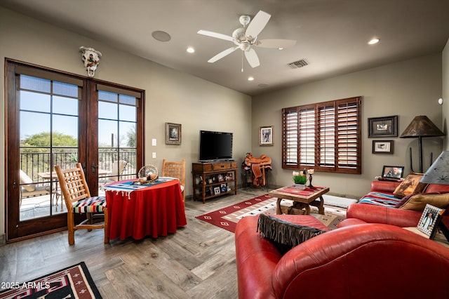 living area with a ceiling fan and recessed lighting