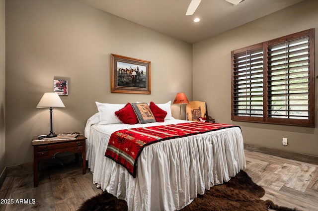bedroom featuring baseboards, recessed lighting, wood finished floors, and ceiling fan