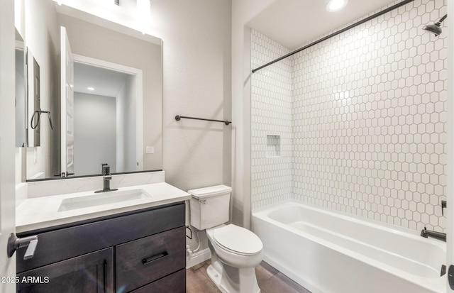 full bathroom with washtub / shower combination, vanity, and toilet