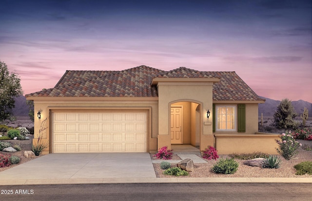 7661 W Meadowlark Way, Florence, AZ 85132 - mediterranean / spanish house featuring stucco siding, a garage, driveway, and a tiled roof
